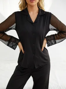 Detailed look at black modal pajamas with mesh sleeves and exquisite lace cuff details