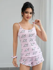 Two-piece pink heart print camisole and ruffle shorts pajama set for women lounging