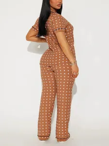 Brown polka dot two-piece pajama set featuring a short-sleeved top and long pants.