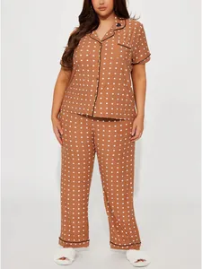 Plus-size women's brown polka dot pajama set with short sleeves and long pants