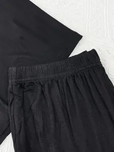 Close-up of black modal pajama set showing elastic waistband and soft fabric texture