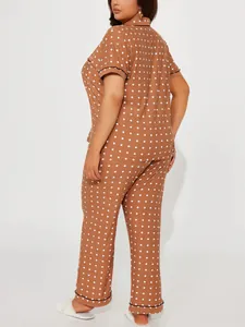 Rear view of brown and white polka dot pajama set with short sleeves and long pants