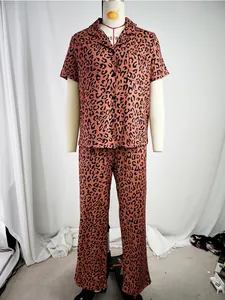 Detail view of women's leopard print pajamas set featuring short-sleeve shirt and pants