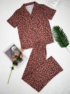 Detail shot of leopard print pajama set featuring lapel short sleeve shirt and long pants