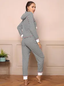 Detail view of women's black and white striped pajama set with hoodie and pants