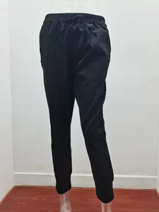 Front view of black slim-fit cotton linen casual pants with drawstring waist on mannequin