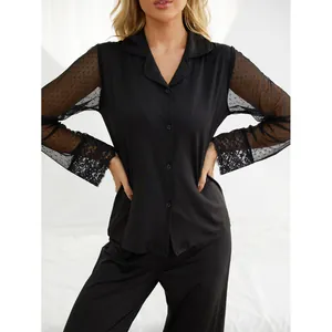 Elegant black two-piece pajama set with mesh polka dot sleeves and delicate lace cuffs