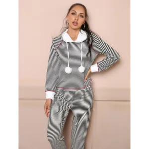 Cozy women's two-piece black and white striped pajama set with fuzzy hood and pom-poms