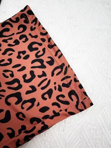 Macro view of high-quality stitching on leopard print pajama nightwear fabric for women