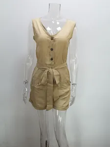 Front view detail of khaki sleeveless V-neck romper with button closure and bow tie waist