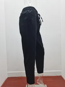 Side view of black cotton linen drawstring casual pants with elastic cuffs for women