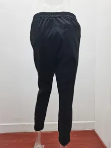 Back view of black slim fit cotton linen cropped jogger pants shown on a mannequin.