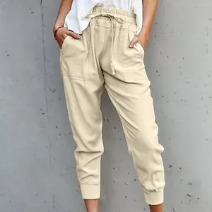 Close-up view of women's minimalist beige cotton linen casual drawstring jogger pants