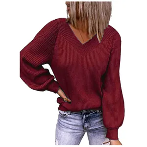 Detail view of women's burgundy V-neck ribbed knit sweater with elegant puff sleeves