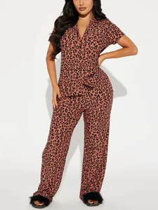 Detail of women's leopard print short sleeve pajama set with button-down top and pants