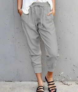 Detail of grey cotton linen casual pants with drawstring waist and cropped hem