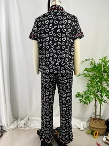 Elegant back view of heart-print pajama set with short-sleeve top and long pants