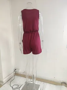 Back view of sleeveless wine red romper with elasticated waist on a mannequin.