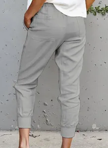 Detailed back view of women's gray cotton linen cropped jogger pants with elastic cuffs