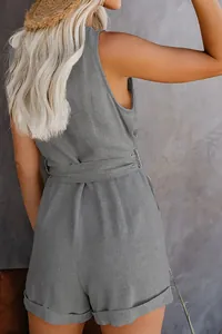 Detailed back view of a grey sleeveless summer romper with belt and linen texture