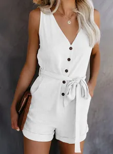 Close-up detail of a white V-neck sleeveless romper with button front and tie waist bow