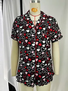 Comfortable two-piece heart print pajama set with short sleeves and elegant red piping