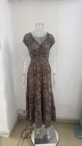 Detailed view of bohemian paisley print maxi dress with ruffled sleeves and elastic waist