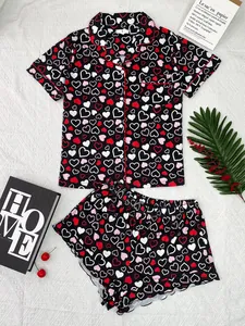 Detail of women's heart print pajama set with short sleeves and shorts in black