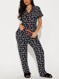 Two-piece black and white heart print pajama set with short-sleeve top and long pants