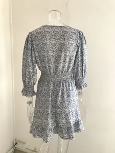 Back view of a Bohemian floral print dress with elastic waist and ruffled hem