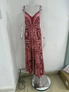 Bohemian ethnic print maxi dress with V-neck and high waist displayed on a mannequin
