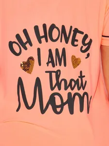 Detail of 'OH HONEY, I AM That Mom' print with sequin hearts on peach pajama top