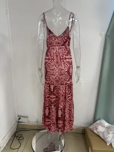 Back view of bohemian paisley print maxi dress featuring elegant spaghetti straps