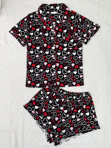 Detailed flat lay of women's heart print pajama set featuring short sleeves and shorts