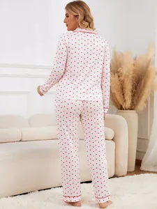 Rear view of a soft two-piece women's pajama set featuring a classic red heart pattern