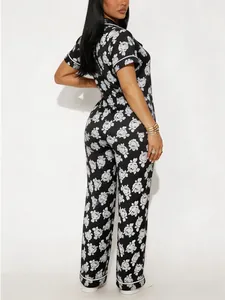 Detailed view of women's two-piece floral pajama set with short sleeves and long pants