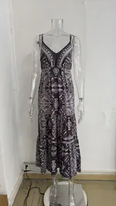 Detail view of Bohemian V-neck maxi dress with paisley print on clear mannequin