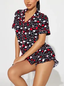 Detail view showing the heart print pattern and red piping on a women's pajama set