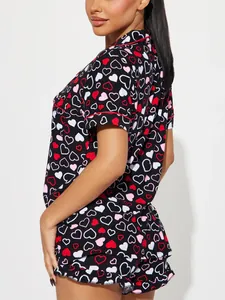 Detailed side view showing heart pattern and piping on women's black summer pajama