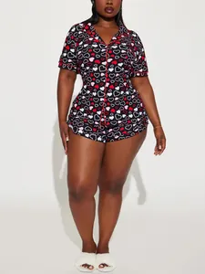 Detailed view of women's plus size short-sleeve pajama set with red heart prints