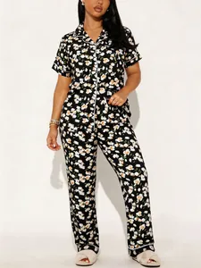 Two-piece women's floral pajama set featuring a short-sleeved lapel shirt and matching long pants.