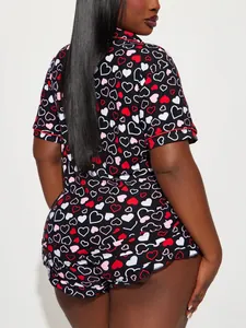 Back view detail of women's heart-print short-sleeve pajama set with red piping