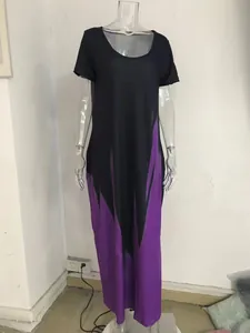 Full view of a black and purple gradient print maxi dress on a clear mannequin.