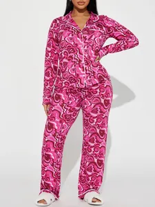 Full view of women's long-sleeve pajama set with vibrant pink psychedelic print