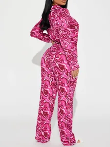 Women's pink heart print pajama set with long sleeves and lapel in a two-piece design