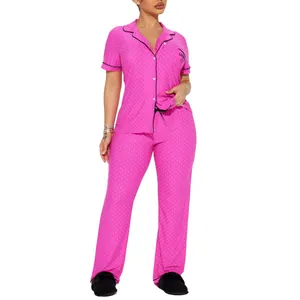 Pink polka dot pajama set for women with short sleeve button-up top and long pants
