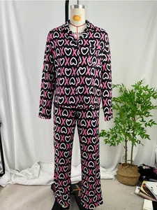 Full view of women's heart and X print pajama set with long sleeves and long pants.