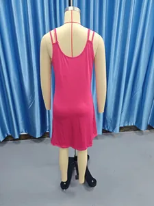 Back view of a vibrant pink slim-fit sleeveless slip dress on a mannequin