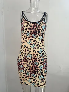Detailed view of the leopard print slip dress with blue butterfly patterns on a mannequin