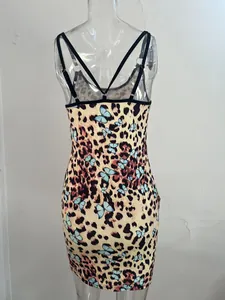 Detailed back view of a bodycon dress with leopard and blue butterfly print